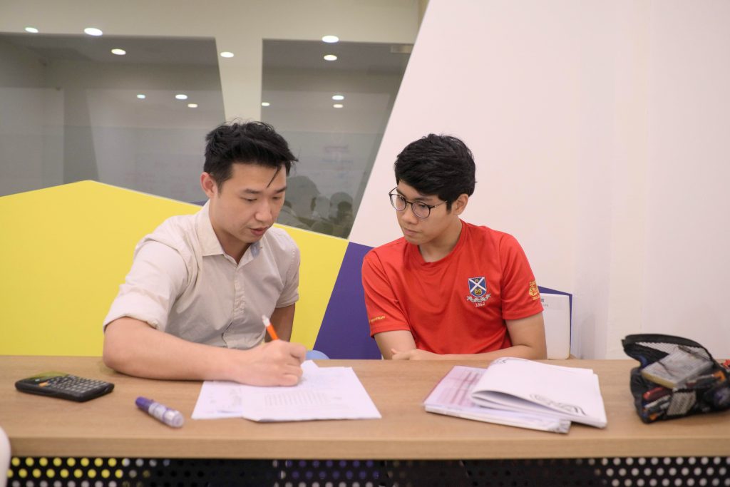 TSA science tutor helping student with their work
