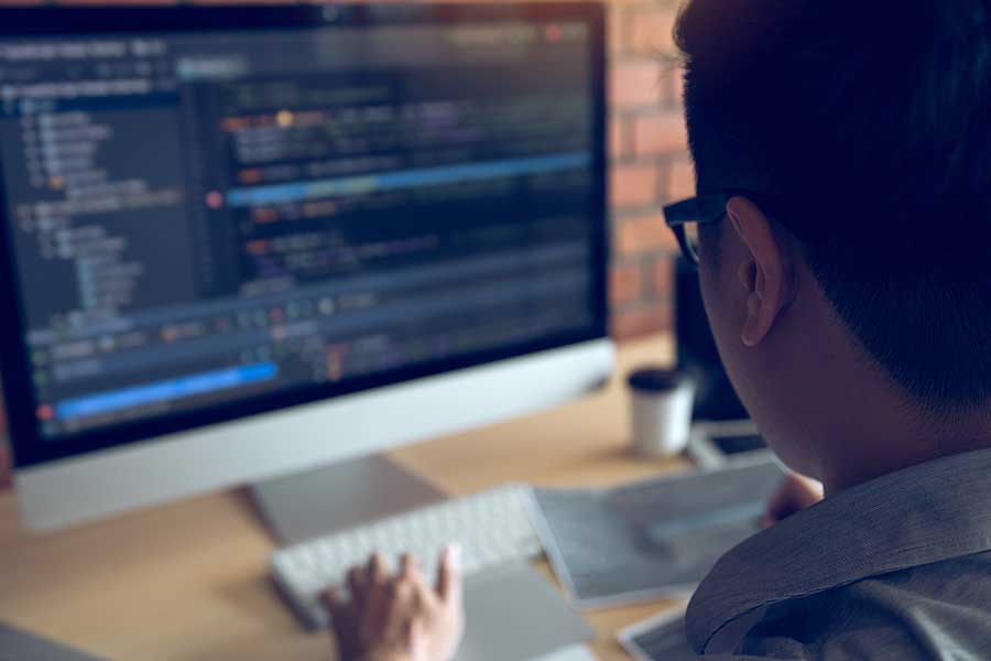 programmer working on physics problems on the computer