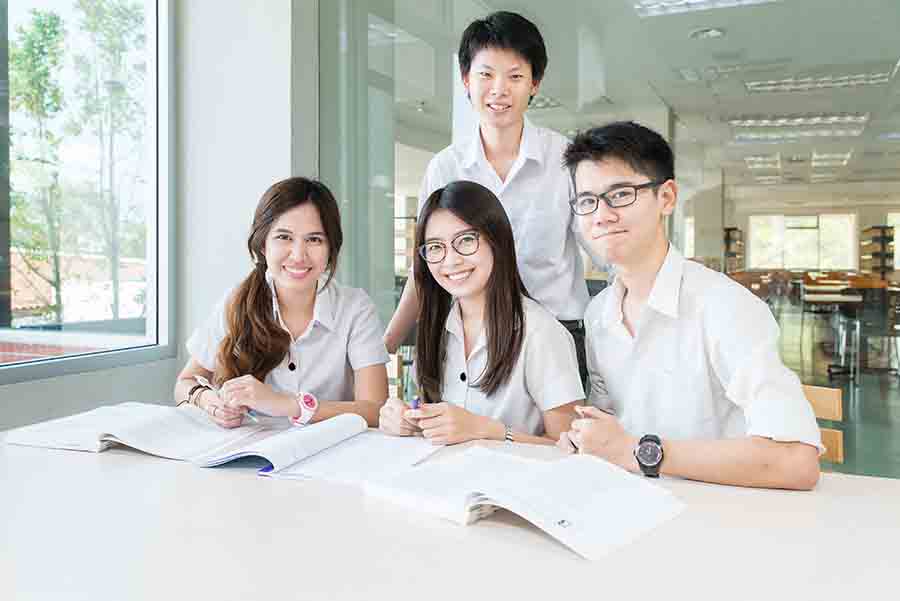 group of jc chemistry students studying together
