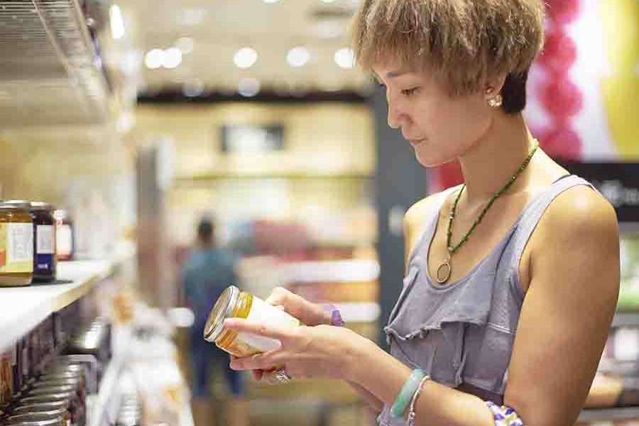 woman inspecting ingredients and chemistry components in food woman inspecting ingredients and chemistry components in food