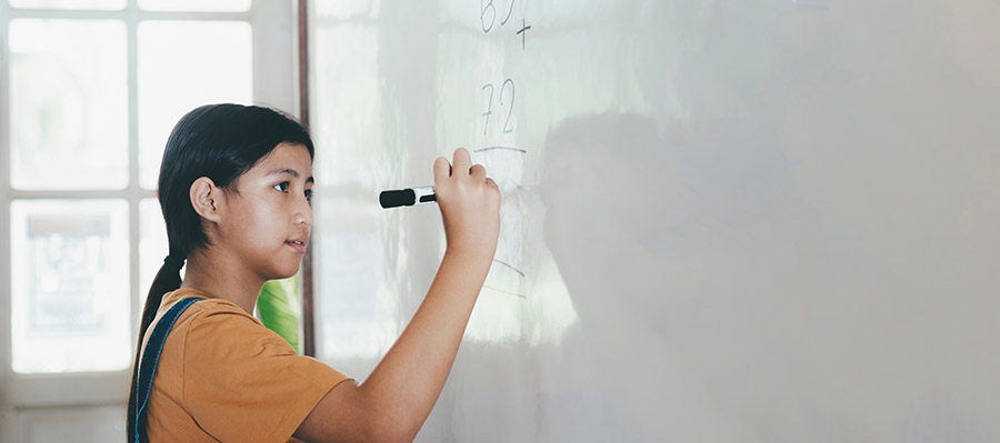 girl studying hard to prevent falling behind in math